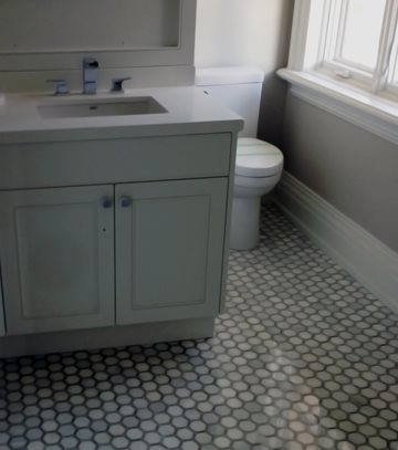 Minimalistic Neutral Bathroom with Patterned Floor Tiling hexagonal tile flooring