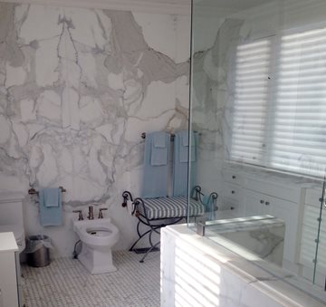 Greco-Roman Style Master Bath Update with Marble Walls marble bathroom design